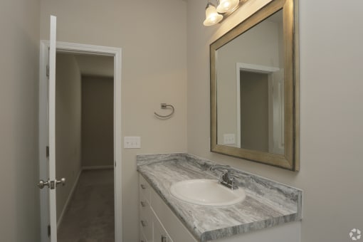 Modern bathroom with large mirror Highborne apartments Augusta, GA