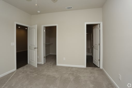 Spacious bedroom with plush carpet at Highborne apartments Augusta, GA