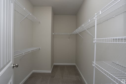 Spacious walk-in closet with shelving at Highborne apartments Augusta, GA