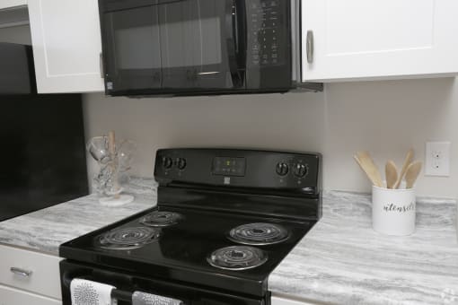 Kitchen at HIghborne apartments with black appliances Augusta, GA
