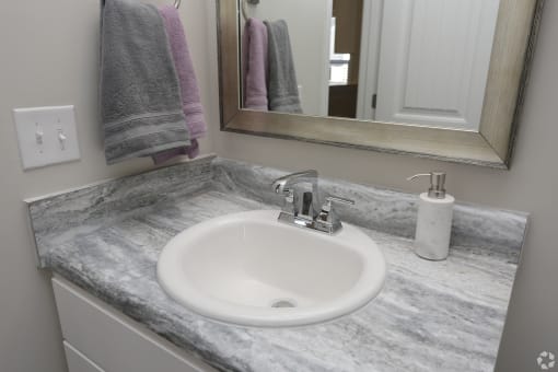 Spacious bathroom sink countertop at Highborne apartments Augusta, GA