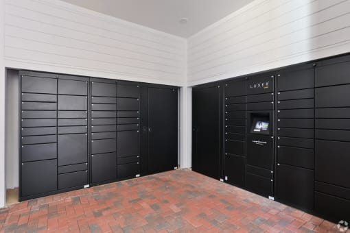 a row of lockers in a room with a brick floor