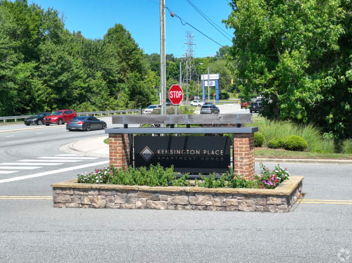 the sign at the intersection of a road with a stop sign