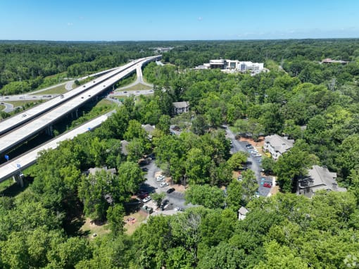 an aerial view of a neighborhood next to a highway