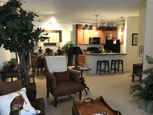 Living room and kitchen with furniture and island at the Haven at Knob Creek Apartments Johnson City, TN