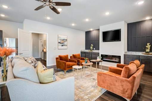 A living room with a fireplace, a television, and a sofa.