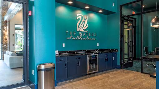 The Waters at Seltzerville is a modern establishment with a blue wall and a logo on it.