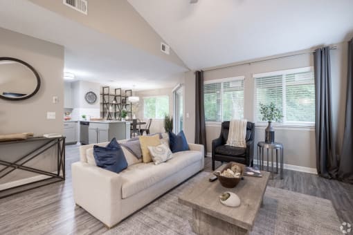 the living room of a home with a couch and a table