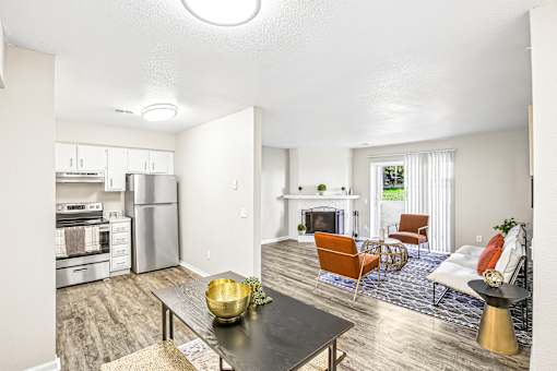 A modern kitchen with a dining table and chairs.