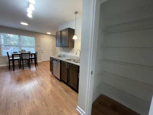 Kitchen with pantry closet at Oasis at Cedar Branch in Wilmington, NC