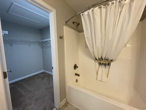 Bathroom with connecting closet at Oasis at Cedar Branch in Wilmington, NC