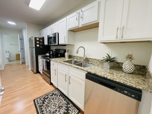 Kitchen with granite counters at Oasis at Twinwood in Wilmington, NC