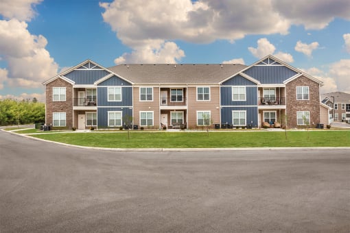 a large apartment complex with a blue sky in the background at Park 33, Goshen, IN 46526