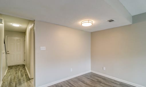 an empty room with white walls and a white door at Savan Pointe Townhomes East and West, Georgia, 31406