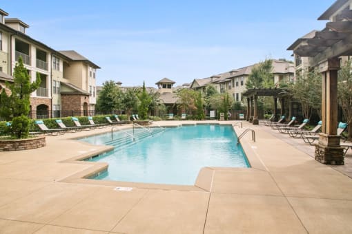the swimming pool at the preserve at polo towers apartments