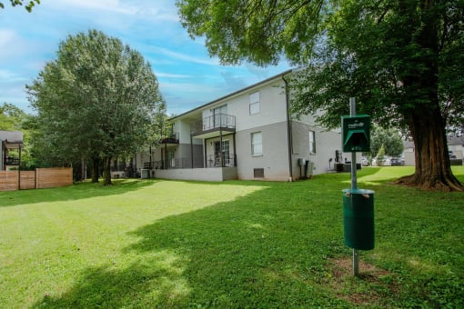 the front of a house with a green yard and trees at The Dylan, Murfreesboro, 37129