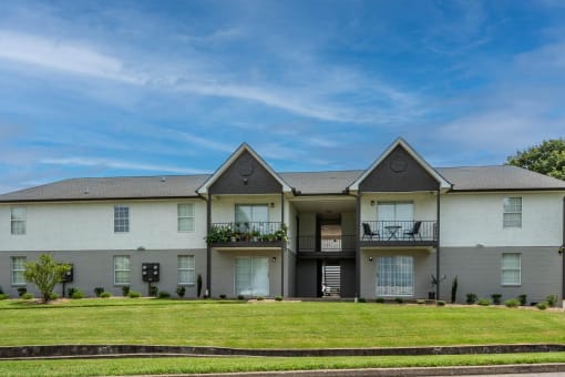 a large white house with a lawn in front of it at The Dylan, Tennessee, 37129