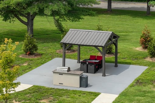 a patio with a picnic table and a barbecue grill at The Dylan, Tennessee
