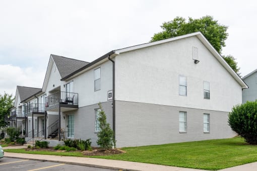 a white building with a lawn in front of it at The Dylan, Tennessee 