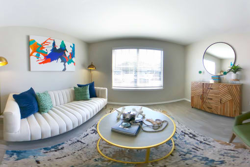 a living room with a white couch and a coffee table at The Dylan, Tennessee, 37129