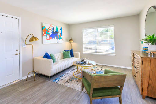 a living room with a couch and a chair at The Dylan, Murfreesboro Tennessee