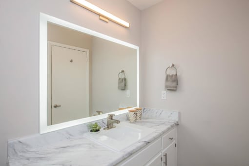 a bathroom with a sink and a mirror at The Dylan, Murfreesboro, TN 37129