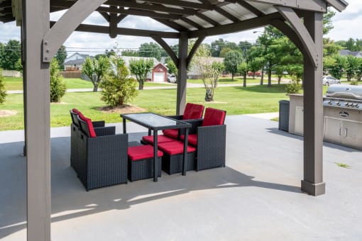 a patio with a table and chairs on a porch at The Dylan, Tennessee, 37129