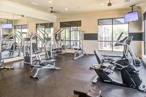 the gym is equipped with state of the art cardio equipment and weights at Century HomePlace, Prattville