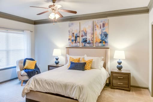 a bedroom with a bed and a ceiling fan at Century HomePlace, Prattville, AL