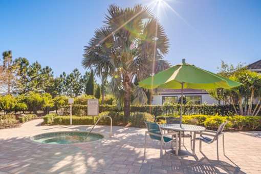 A sunny day at the outdoor seating area with a pool.at Century Ariva, Lakeland  