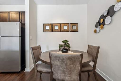 A dining room with a table and chairs.at Century Hampton Roads, Suffolk, 23435  