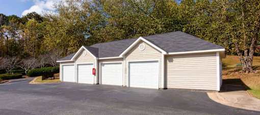 A two-car garage with a red fire extinguisher on the wall.