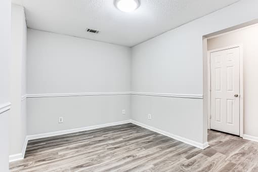 Dinning room with wood-like flooring at Parkside at Sandy Springs Atlanta, GA