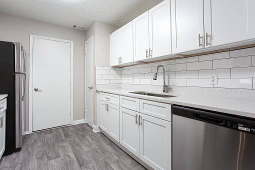 Gourmet kitchen with wood like flooring at Parkside at Sandy Springs Atlanta, GA