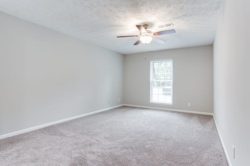 Ceiling fan and plush carpet at Parkside at Sandy Springs Atlanta, GA