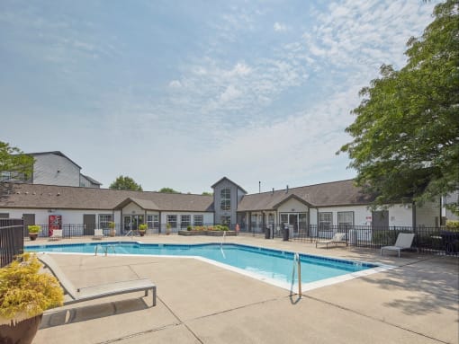 our apartments offer a swimming pool with our buildings in the background