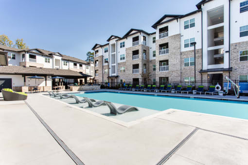 the preserve at ballantyne commons swimming pool with apartment buildings