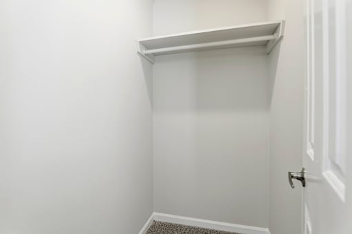 A white door with a silver handle is on the right side of the image.