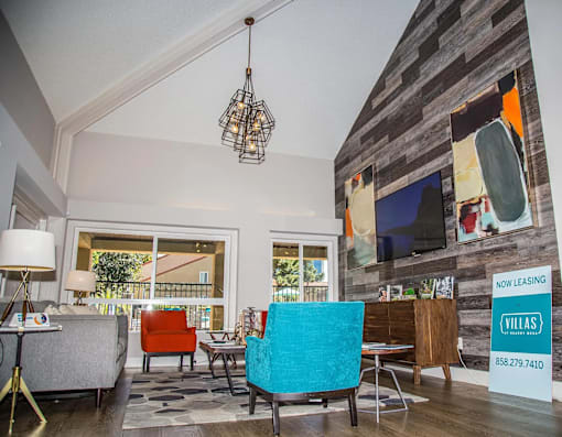 a living room with a couch and chairs and a table