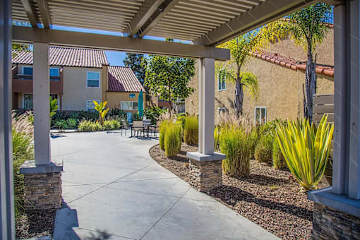 an outdoor patio area at the preserve at tampa palms apartments in tampa