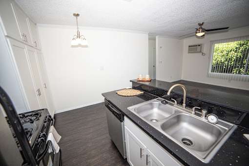 this is a photo of the kitchen of the 882 square foot 2 bedroom apartment at the