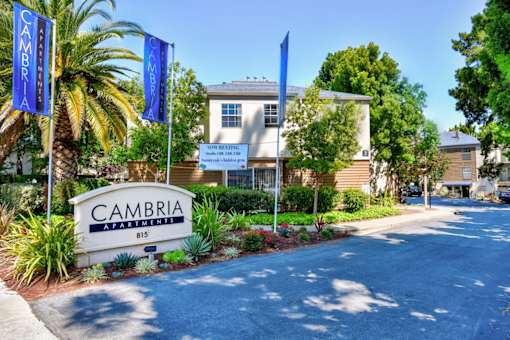 A building with a sign that says "CAMBRIA" in front of it.