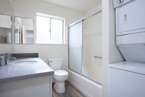 a bathroom with a sink toilet and a shower