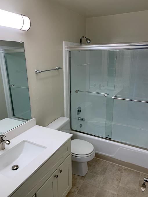 a bathroom with a sink toilet and a shower