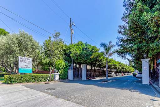 A street view of Moorpark Gardens with a sign in the foreground.