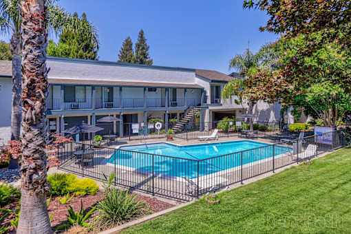 A large house with a pool in the backyard.