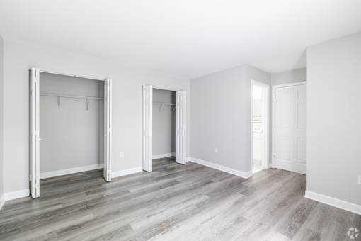 A room with a grey floor and white walls.