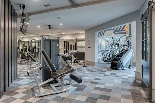 Gym with a variety of equipment including a rowing machine at Caldwell, Texas, 77084