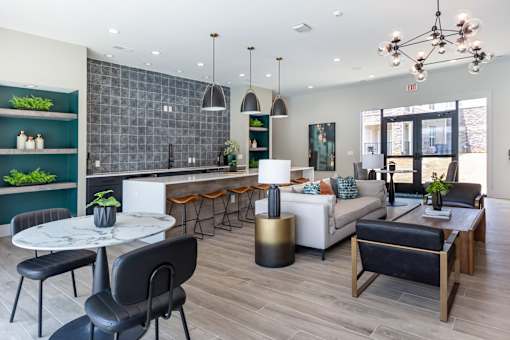 A modern living room with a dining table and chairs.