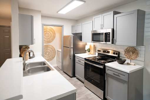Kitchen with Stainless Steel Appliances at The Addison at Collierville Apartments, Collierville